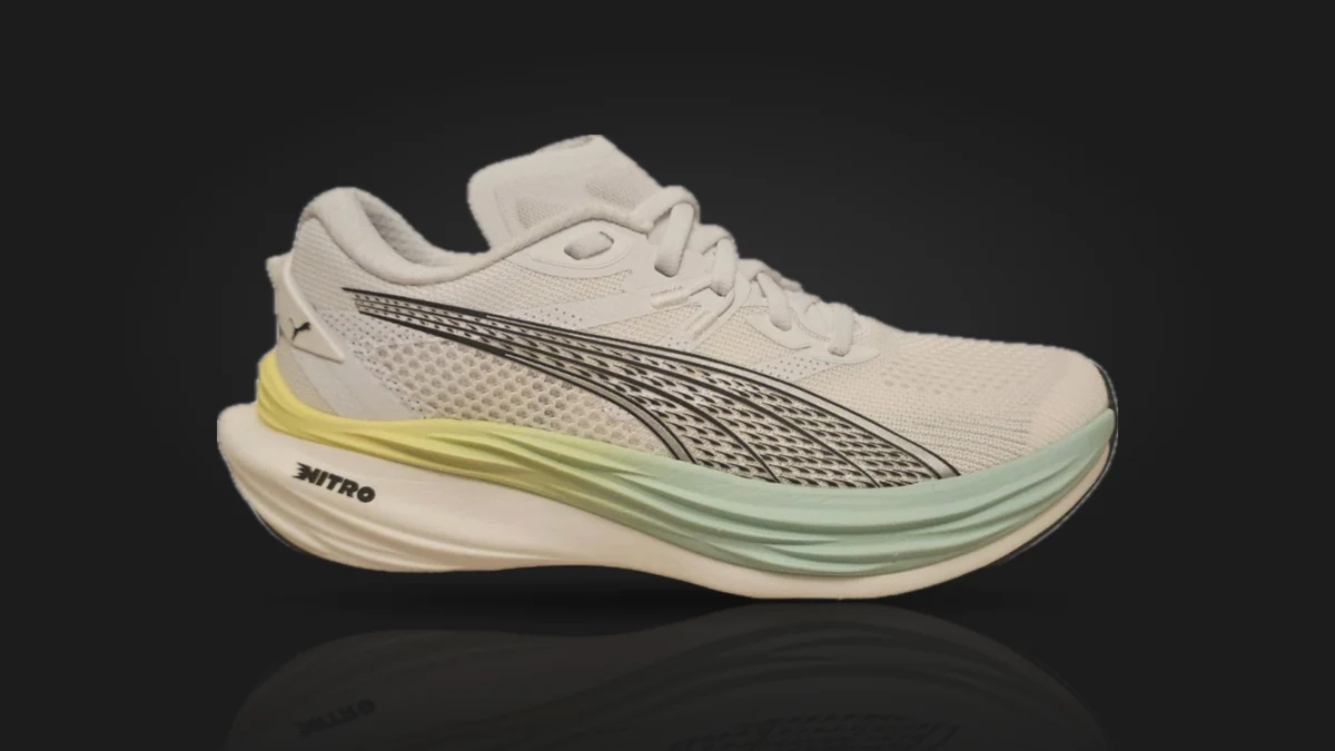 The PUMA Deviate NITRO 3 from the side: a pale grey knit upper with PUMA's stripe in black, over a yellow and mint NITRO midsole