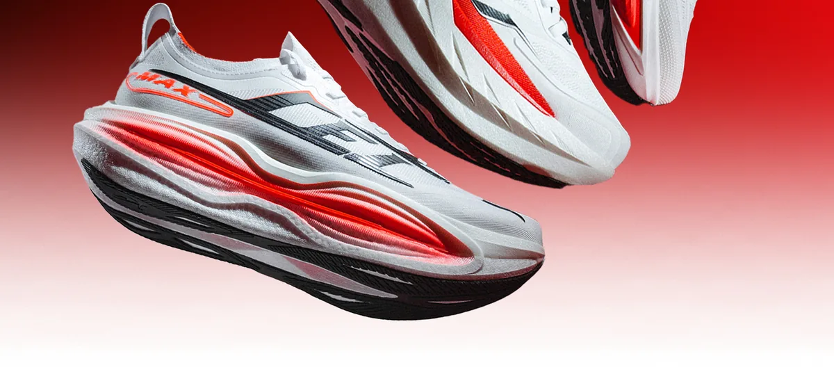 The Qiaodan Leili 2.0 MAX in white, with black diagonal stripes and a red-lit midsole, in front of the Leili 2 GT.