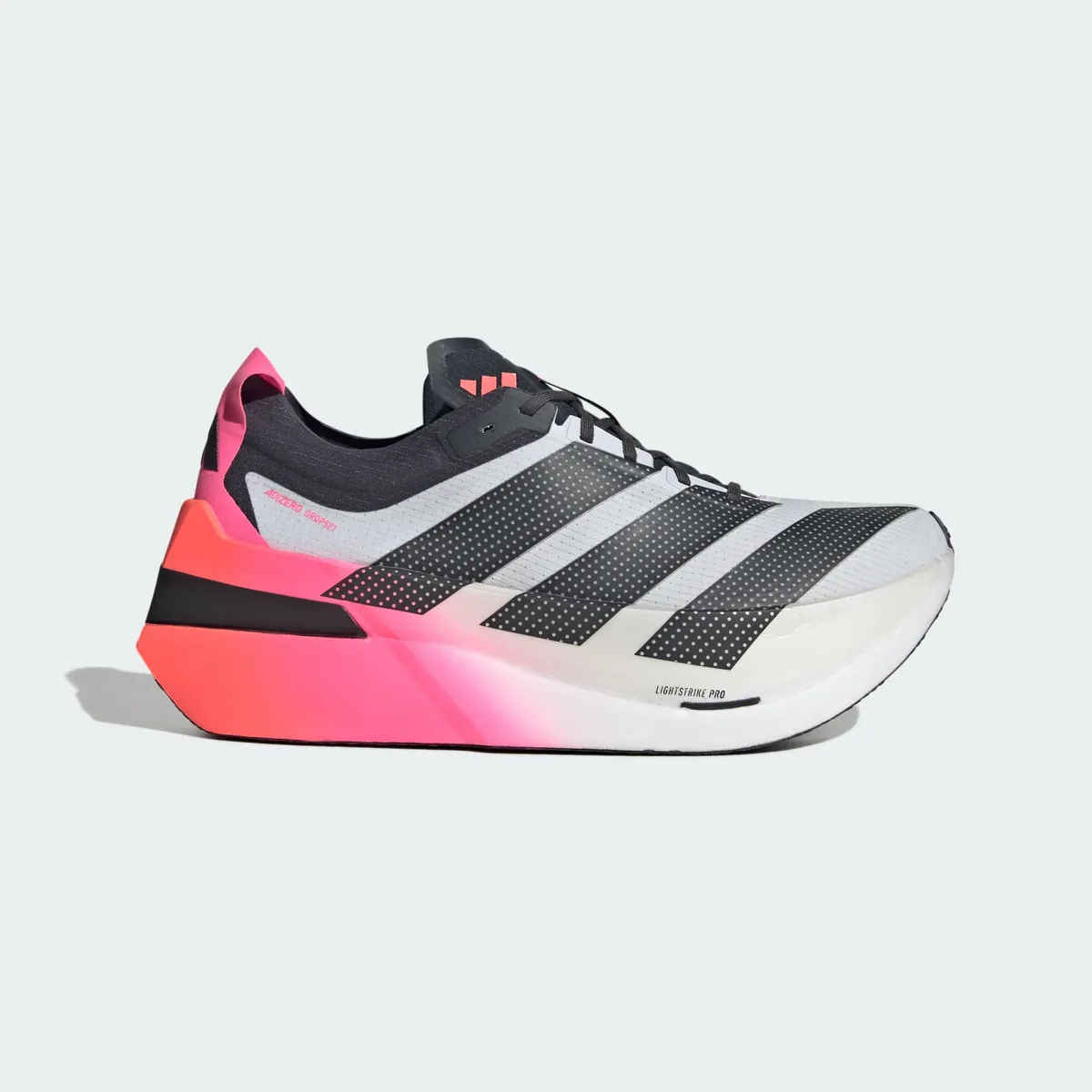 The adidas Adizero Dropset Elite in white and black, on a pink and coral sole.