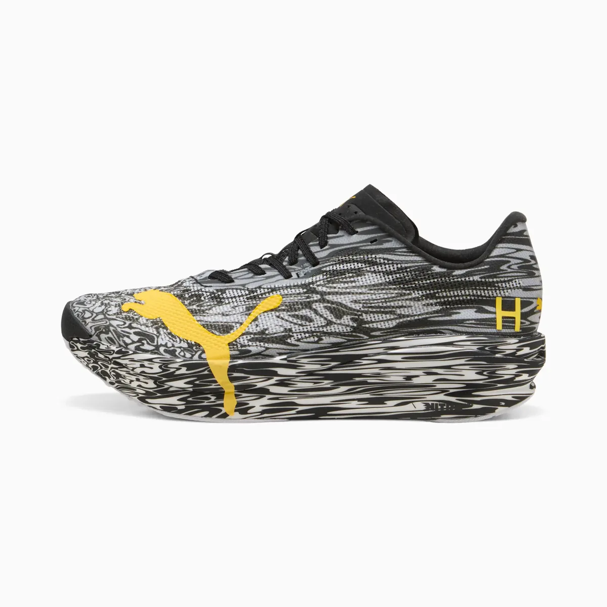The PUMA Hybrid RCN HYROX Nitro Elite in black and grey camo with yellow details.